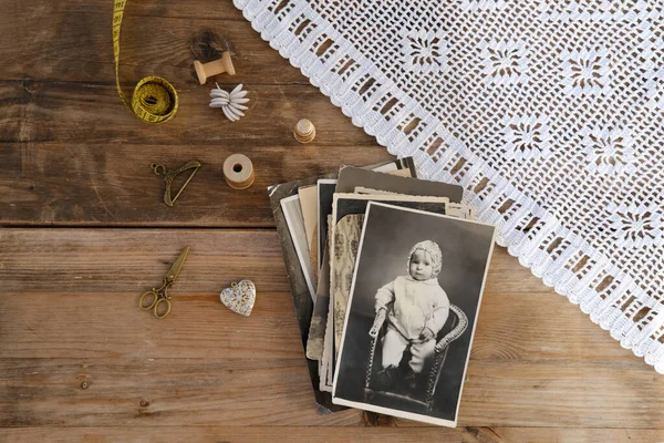 stock image old vintage monochrome photographs scattered on rustic wooden table, dear to heart memorabilia, decor, concept family tree, genealogy, childhood memories, retro inspiration, old-fashioned charm