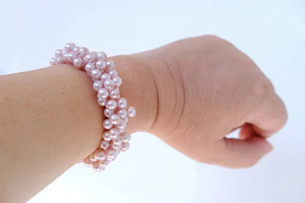Beautiful Bracelet Made Pink Pearls Elastic Band Scrunchie Female Hand — Stockfoto
