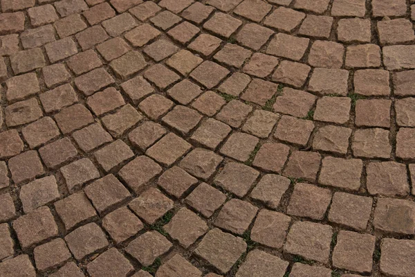 古い中世の石の道路 茶色の自然な背景 橋の道路 パターン テクスチャ 歴史的な床カバーの断片 コピースペースの閉鎖ラフ玄武岩テクスチャ — ストック写真