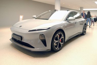 electric SUV from Chinese brand Nio, all-electric sedan ET5 in Studio, elegance electric vehicle in showroom, zero-emission transportation concept, electric car innovation, Frankfurt - July 1, 2023 clipart