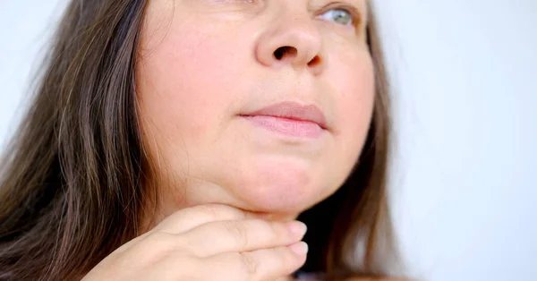 middle eged fat woman, part face, human fat neck, side view, double saggy chin, deep wrinkles, age-related skin changes, cosmetic anti-aging procedures, Body Positivity