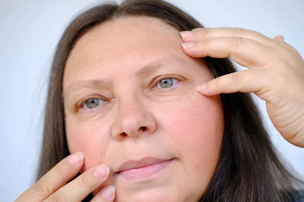 Closeup Female Face Woman Years Old Looks Mirror Checks Skin — Stock Photo, Image