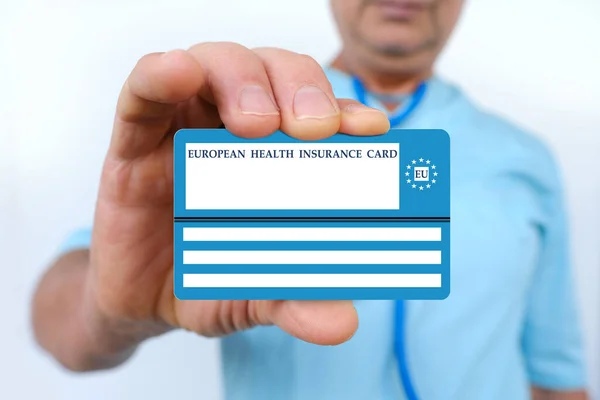 electronic public health insurance cheaper, Insurance Card EU in male doctor\'s hand, concept medical support on trip to Europe, emergency treatment services, healthcare coverage abroad, card security