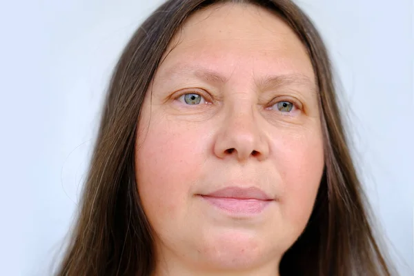 stock image closeup female head, woman 40-45 years old looking, chestnut brown long hair, concept self-reflection, related beauty haircare, promoting haircare, genetic diagnosis, living in present moment