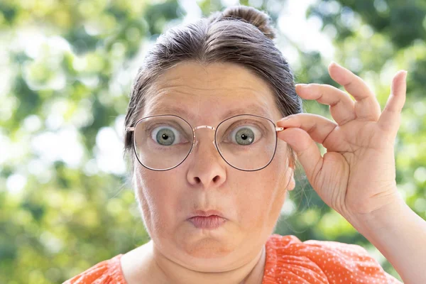 Close Female Face Funny Woman Glasses Looks Lenses Surprise Concept — Stock Photo, Image