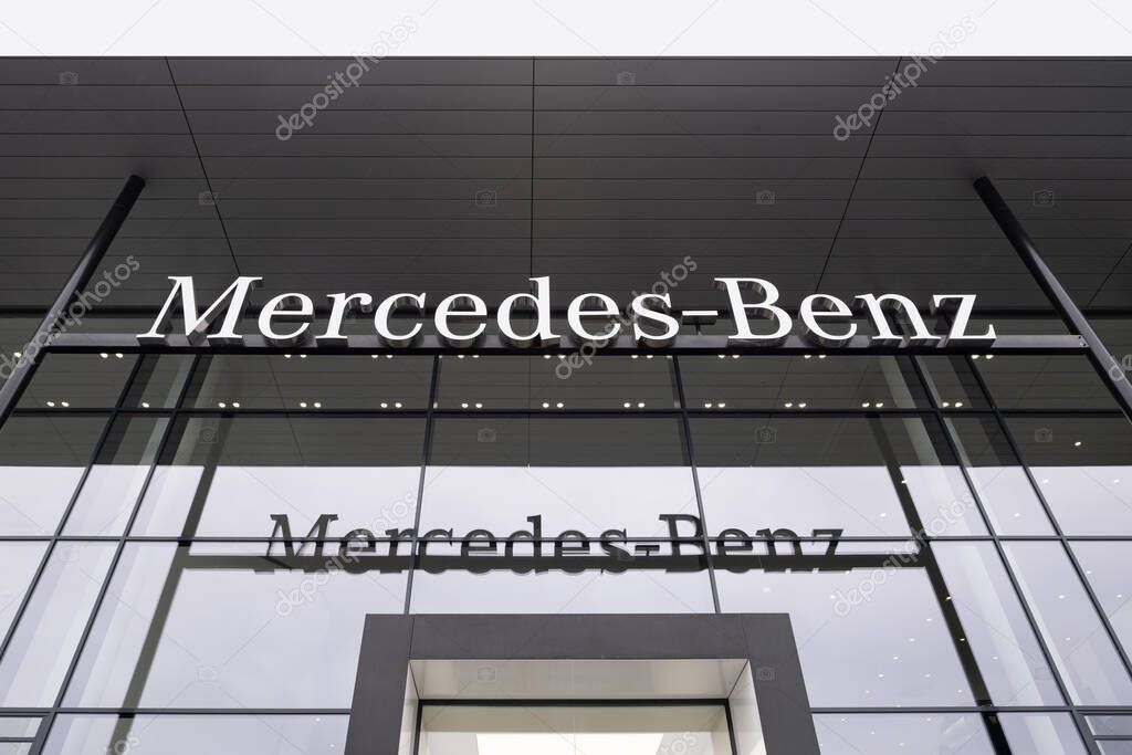Advertising banners of Mercedes-Benz, Sales Office, emblem Daimler Motor, concept Advertising and Marketing in Automotive Industry, British automobile manufacturer, Frankfurt - November 9, 2023