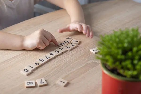 preschooler learning to count, Child studying numbers on wooden squares, Mathematical Educational Methods, Math Skills, Parental Involvement, Early Learning, Educational Toys, Childhood Development