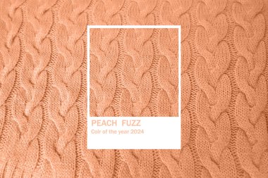 beautiful Peach Fuzz knitted braid pattern of light brown wool yarn, knitted texture, concept warm things for cold weather, knitting hobby, needlework, fashion clothes, Frankfurt - December 7, 2023 clipart