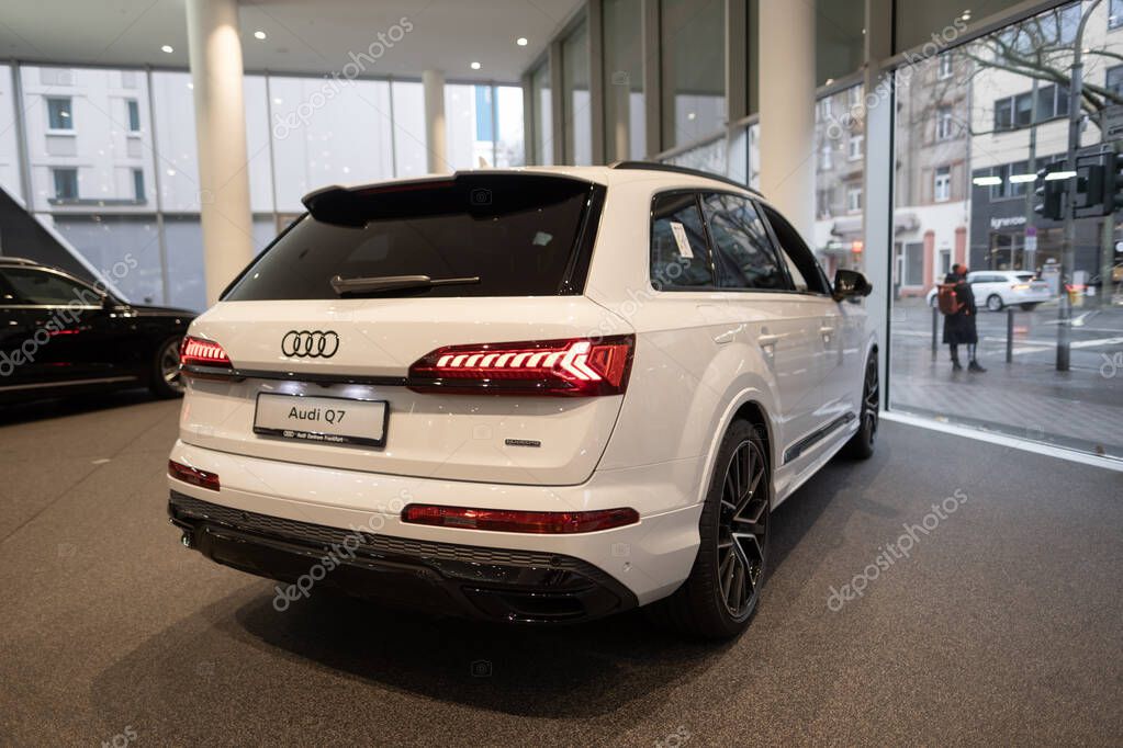 Hybrid SUV Car Audi e-tron Q7 quattro, taillights, white multi-drive vehicle in showroom rear view, Sustainable Mobility, Technology automotive industry show in Frankfurt, Germany - January 22, 2024