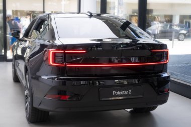 new electric Polestar 2 car Swedish company Polestar in showroom, trends in use EV in contemporary Europe, technological advancements in automotive industry, Frankfurt - September 3, 2023 clipart