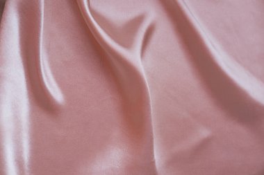 Yumuşak, yumuşak kıvrımlı pembe pastel renkli zarif ipek dokusu, iç tasarım konsepti, ipek kumaş arka planı, tasarımcı için kopyalama alanı, maket