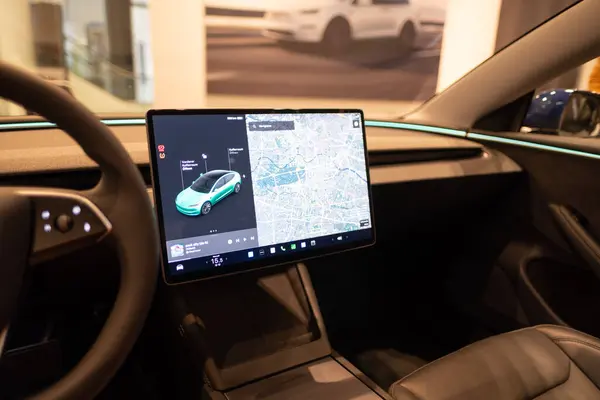 stock image electronic display, steering wheel, Tesla electric car model 3 Interior, Highland light strip, cockpit EV technologies car manufacturing, eco-friendly engines, Berlin, Germany - February 17, 2024