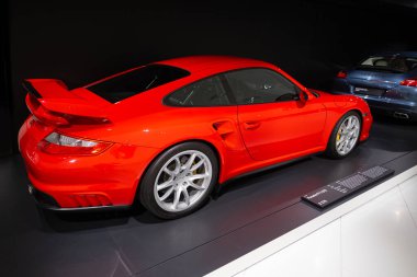 red modern Porsche 911 GT2 RS, luxury classic sports car 2011, Porsche museum, automotive passion, evolution sports cars, Innovation automotive industry show in Stuttgart, Germany - January 26, 2024 clipart