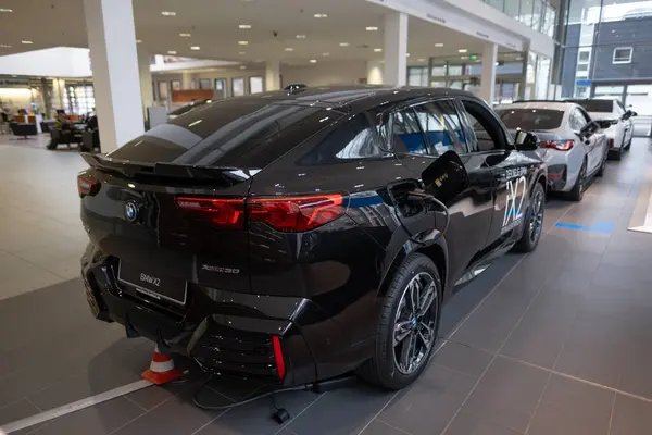 stock image black electric cross-coupe BMW iX2 mid-size crossover German manufacturer BMW AG, Advanced technology in automotive industry, Sustainable Transportation, Frankfurt, Germany - January 22, 2024