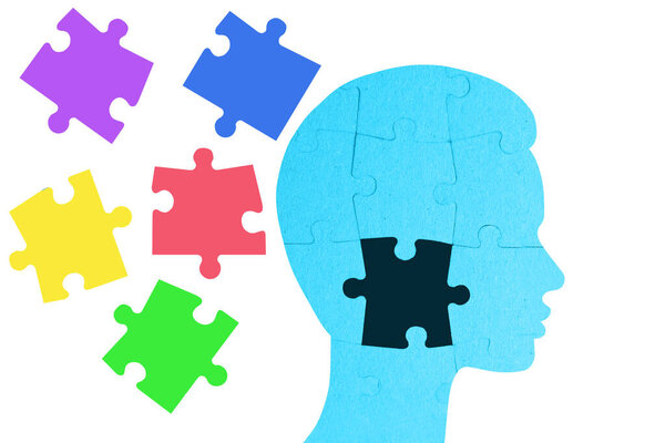 head puzzle with copy space on background, missing piece of brain puzzle, mental health and problems with memory, Creative background