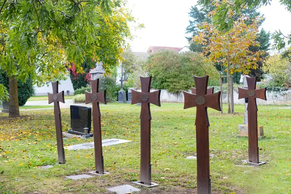 old iron grave crosses in cemetery with empty blank space, beginning of something important, mock up of old texture, background for designer copy space