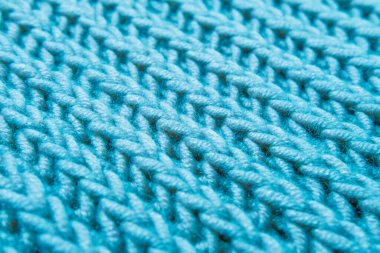 Güzel mavi örgü örgülü yün desenler, örgü kumaş, konsept soğuk hava için sıcak şeyler örgü hobisi, nakış işi, moda kıyafeti.