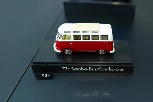 stock image classic vintage red and white Volkswagen bus model, automotive pop culture nostalgia 1960s, display Iconic show Volkswagen Group Forum in Berlin, Germany - April 24, 2024