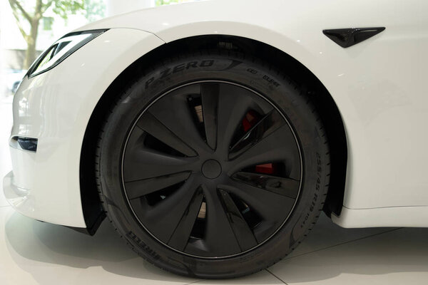 White Model S Plaid, wheel close-up, innovative electric car Tesla Motors in studio, trend in use EV in contemporary Europe, Automotive industry, Frankfurt, Germany - June 28, 2024
