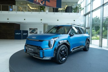 new blue electric Kia Niro GT-line, South Korean e-Niro innovative electric car in studio, trend EV in Europe, Automotive industry, Frankfurt, Germany - June 28, 2024 clipart