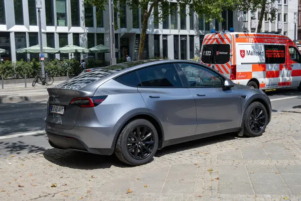 stock image silver Tesla Model Y on street, Elon Musk Tesla motor company, supercar dynamics, Automotive industry, Frankfurt, Germany - July 22, 2024