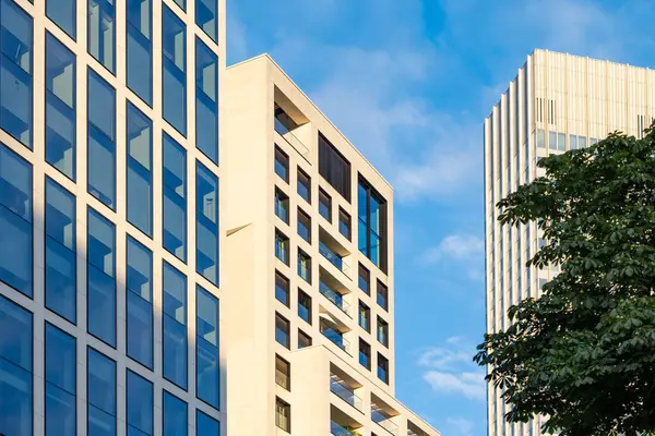 stock image fragments multi-storey office and residential buildings in European city with reflective glass facades, modern high-rise office buildings and residential towers