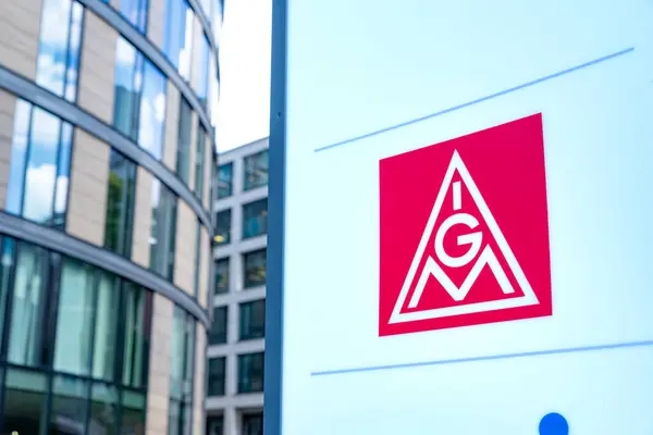 stock image Red IGM advertising IG Metall sign, German dominant metalworkers union on building, holding sign in support, Europe's largest industrial union, Frankfurt - July 22, 2024