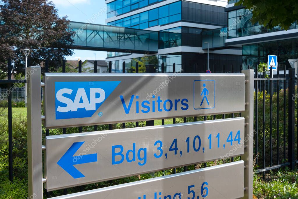 SAP SE logo prominently displayed on modern corporate headquarters facade, SAP corporate campus, symbolizing global software industry leadership, Walldorf, Germany - July 29, 2024