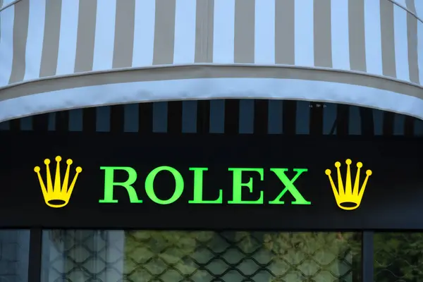 stock image iconic Rolex crown logo, luxury Swiss watch brand and Rolex SA manufacturer, symbol luxury and prestige, high-end classic collector's item, Tivat, Montenegro - August 3, 2024