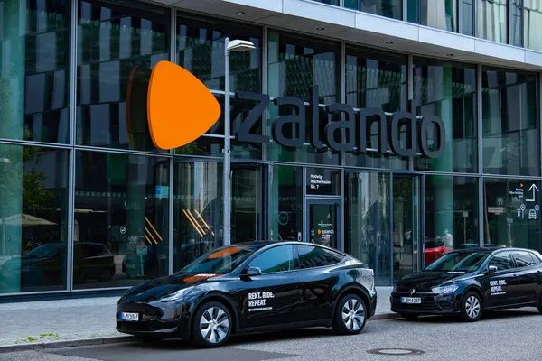 stock image Zalando headquarters, office with iconic orange emblem, delivery shoes, fashionable clothes and cosmetics by mail, storefront, Berlin, Germany - August 15, 2024