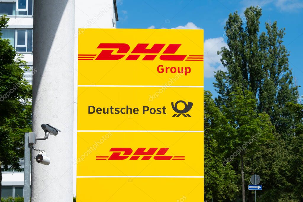 German Yellow DHL, Deutsche Post logo, efficient communication, symbolizing global commerce, postal services in Germany, Frankfurt - May 28, 2024