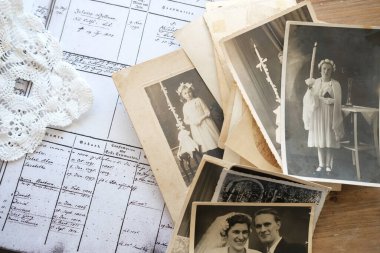 old family photographs, pictures from 1935 in sepia color on wooden table, home archive documents, concept of family tree, genealogy, memories, memory of ancestors, family tree, nostalgia