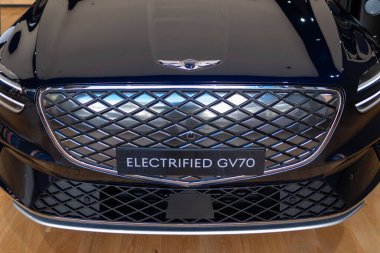 all-electric Hyundai Genesis GV70 car in Studio, popular korean passenger Electric vehicle, alternative energy development, Edinburgh, United Kingdom - October 24, 2024 clipart