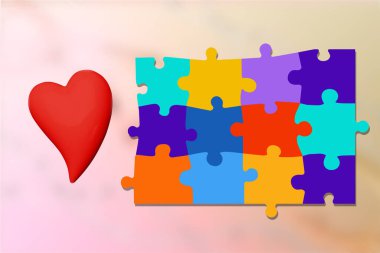 Kalp yapbozu parçaları mavi, kırmızı, sarı, yeşil, erken teşhis ve müdahale şeklinde. Otizmi temsil eden farkındalık, sevgi ve kapsama, bunama ve Alzheimer hastalığıyla mücadelede bilişsel sağlık