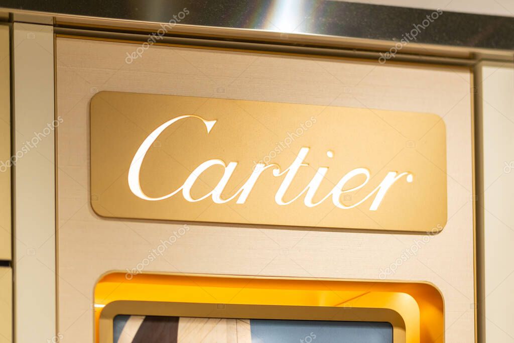 Cartier luxury store, showcasing exquisite jewelry and watches, store entrance, Luxury shopping destination, gold lettering, classic building, Milan, Italy - May 21, 2025