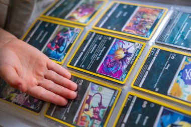 Collecting enthusiast holding rare cards, fan eagerly displays collection football trading cards, Fan Culture, emphasizing fun and hobby collection, Hobbies, Frankfurt - June 8, 2025 