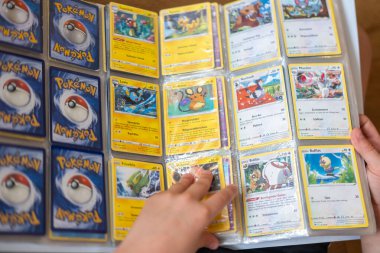 Collecting enthusiast holding rare cards, fan eagerly displays collection football trading cards, Fan Culture, emphasizing fun and hobby collection, Hobbies, Frankfurt - June 8, 2025 