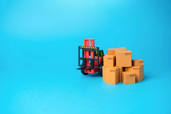 Boxes of goods and forklift. Warehouses, manufacturing facilities, and distribution centers. Inventory accuracy. Supply chain optimization. Efficient logistics and distribution systems.
