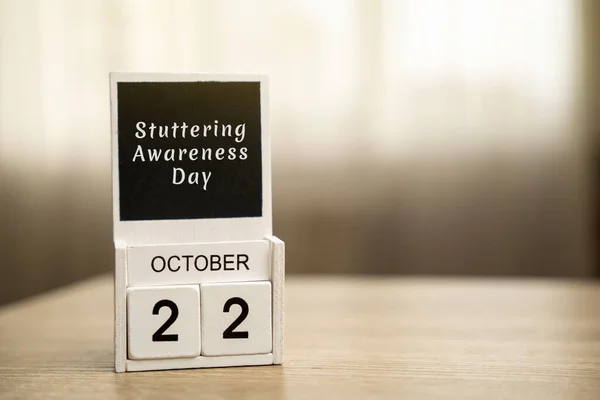 22 october - International Stuttering Awareness Day. Speech disorder. Conceptual image of a calendar with inscription
