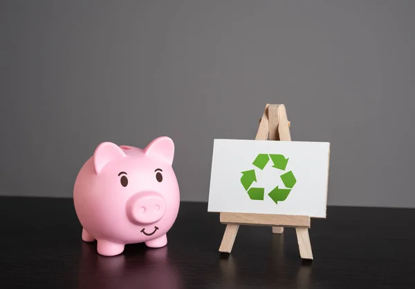 Pig piggy bank and recycling sign. Generate profit. Conserve natural resources, reduce waste, create jobs in recycling industry. Creating revenue streams through sale of recycled materials.