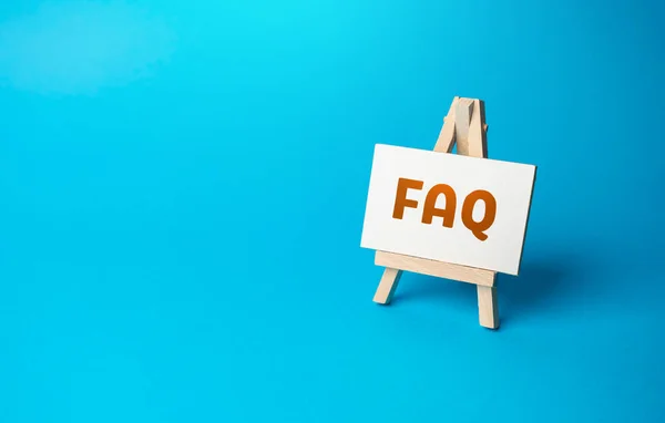 FAQ on an easel stand. Answers to frequently asked questions. Guide to the topic. Curiosity, inquiry, uncertainty. Search for answers, clarity, and understanding. Quest for knowledge or solutions.