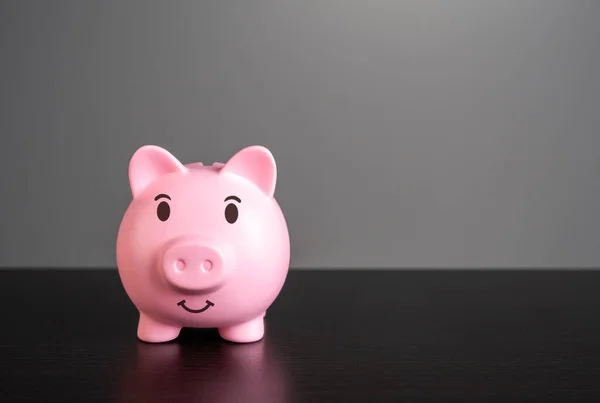 Smiling pig piggy bank with savings. Wealth and prosperity. Savings and deposit banking. Healthy economy. Successful investments and deposits.