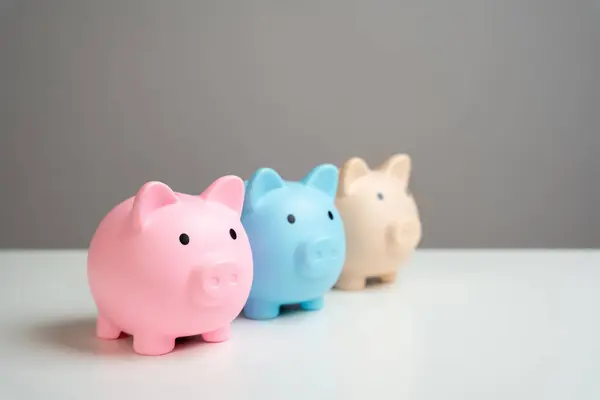 Three piggy banks. Savings and deposit banking. Healthy economy. Diversification of investments and savings. Banking. Good conditions from the bank. Increase capital.