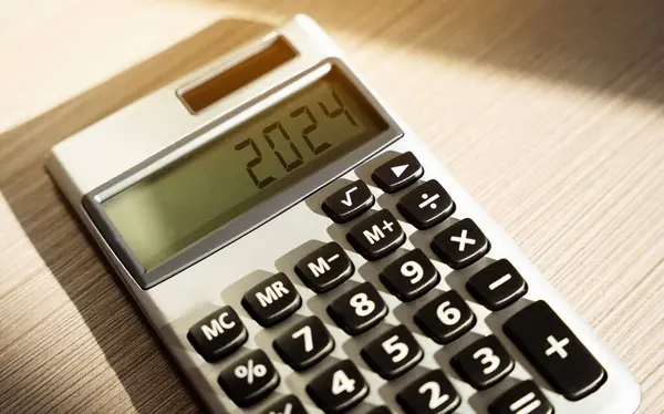 stock image Calculator 2024 close-up. Finance and business concept. Investments and investing money. Planning, profit and income.