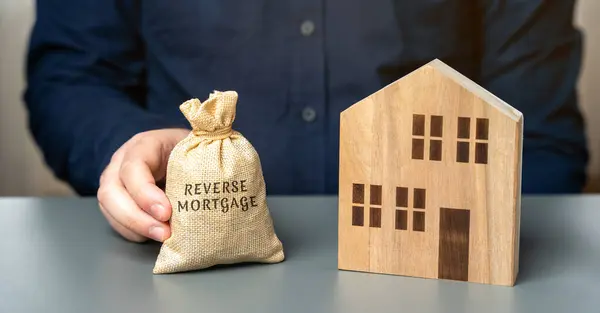 Reverse Mortgage Concept Allowing Homeowners Borrow Money Using Home Collateral Stock Picture