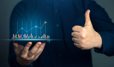 Businessman showing growth charts and thumbs up. Success in business and economics. Successful investments. Income growth and economic development. Optimistic forecast. Entrepreneurship. clipart