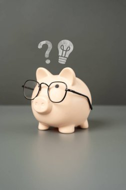 Idea for business and investment. Invest in a startup. Accounting and auditing. To earn money. Deposits and investments. Financial planning and literacy. Save for education. Piggy bank with glasses clipart