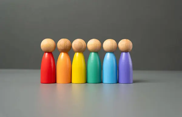 stock image Six people figures in LGBT colors. Pride Month June. International Pride Day. Protection of the rights and freedoms of sexual minorities. Promoting tolerance and social acceptability.