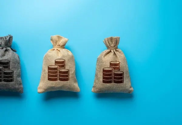 Bags of money on a blue background. Deposits and loans. Banks and banking. Earn Money. Borrow funds. Economics and budgets.