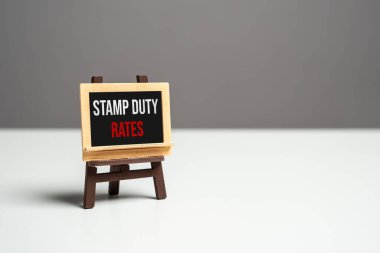 Stamp duty rates on the sign board. Navigating property transactions in real estate market. Taxes and fees. clipart